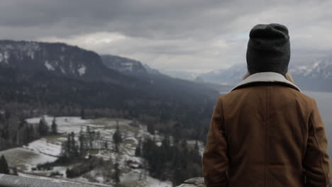 A-girl-gazes-out-at-a-gorge-from-a-scenic-viewpoint