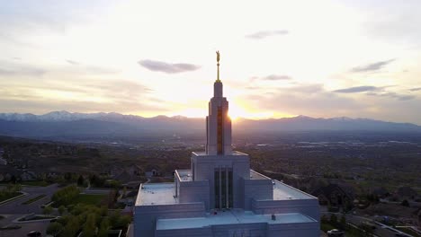 Drone-Shot-of-the-Draper-Temple-with-the-Salt-Lake-Valley-behind-it-during-sunset