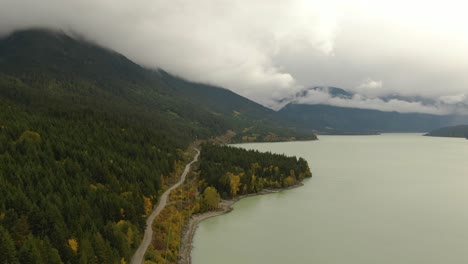 Beautiful-Aerial-Landscape-View-of-a-Scenic-road-in-Canadian-Nature-during-a-Cloudy-Autumn-Day