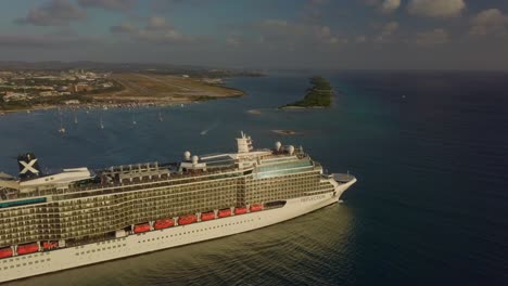 Aerial-view-of-the-cruise-ship-sailing-from-the-marina-and-into-the-deep-sea-4K