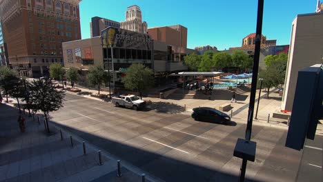 Time-Lapse-of-people-and-traffic-moving-along-South-Central-Avenue-between-CityScape-and-Patriots-Square-Park