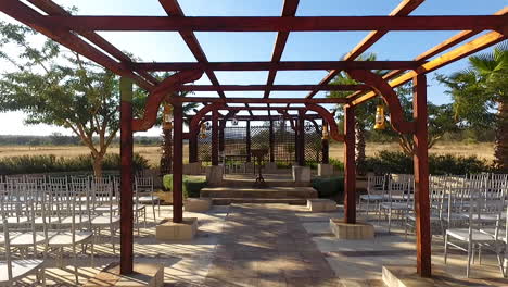 walk-through-view-of-wooden-framework-towards-a-Arbor---wedding-arch-outdoors-in-the-bushveld