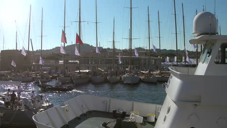 Busy-sea-port-with-sailing-boats-in-the-background-and-ferry-in-the-foreground