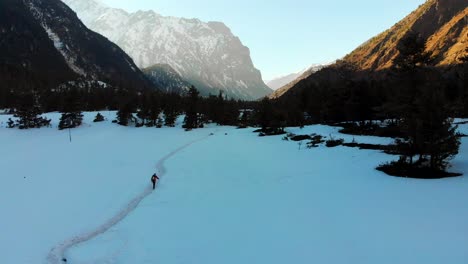 A-solo-trekker-trekking-through-a-snow-trail-in