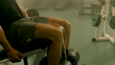 Closeup-strong-man-having-legs-training-at-gym