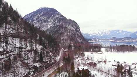 Amazing-aerial-view-of-the-Alps-with-ground-covered-in-white-blanket-of-snow,-HD