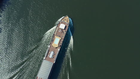 Top-Down-View-Of-a-Boat-Crossing-a-River