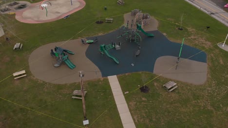 Police-Yellow-Tape-Placed-Around-The-Infected-Area-Of-Spencerport-Playground-In-New-York,-USA-Due-To-COVID-19---Aerial