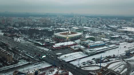 Aerial-shot-at-dusk-slowly-moving-down-on-the-RZD-Arena-stadium,-home-of-the-FC-Lokomotiv-Moscow-in-Moscow,-Russia