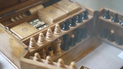 Close-up-of-antique-wooden-chess-and-game-set