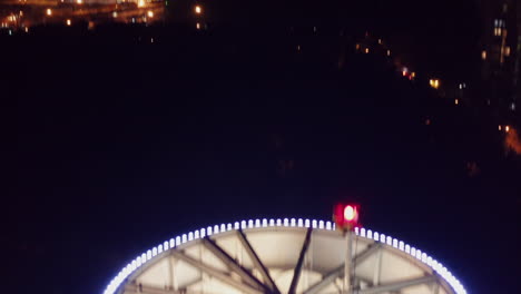 Aerial-shot-of-drop-tower-ride-in-amusement-park