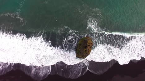 Drone-shot-of-dramatic-landscape-of-Icelandic-Black-Sand-Beach-Reynisfjara-near-town-Vik