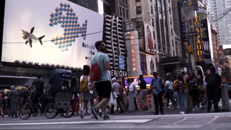 Low-angle-view-of-people-walking-in-slow-motion-near-Tme-Aquare-during-daytime-in-New-York-City-Manhattan