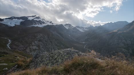 Timelapse-in-the-mountains-of-the-Italian-Alps-on-a-slider-with-moving-clouds-during-sunset