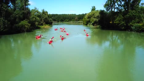 Aerial-view-of-people-on-kayak-on-Danube-river,-Hungary,-on-a-sunny-day