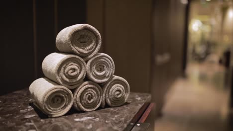 Luxury-Brown-Spa-Towels-Folded-in-Massage-Center-for-Relaxation-Therapy