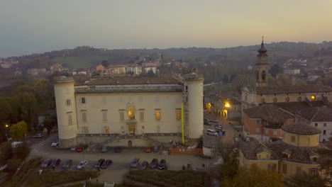 Aerial-drone-perspective-of-Costigliole-d'Asti-castle-in-the-evening,-Italy