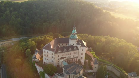 The-aerial-shot-of-the-magical-castle-in-Frydlant-in-Czech-Republic-during-sunset