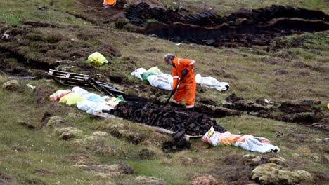 Man-cutting-peat-on-Shetland-Moor