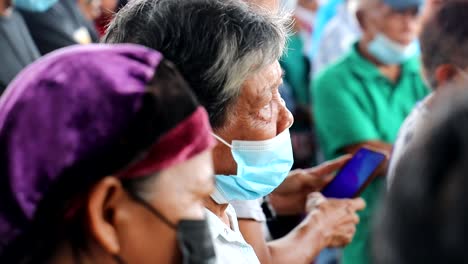 An-elderly-woman-who-suffered-from-a-typhoon-flooding-waiting-for-assistance-from-the-local-government