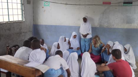 White-volunteers-teachers-in-class-with-african-muslim-children