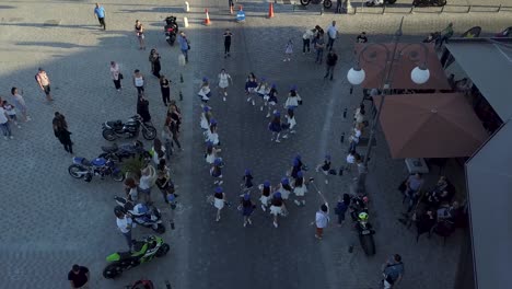 Overhead-shot-Of-Girls-wearing-Nice-Costumes-Cheering-Up-Together-In-Festival