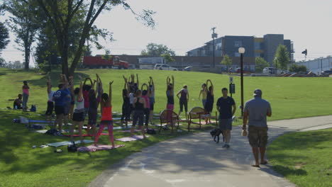 Group-Of-Active-People-Doing-Morning-Exercises-At-The-Park-In-Durham,-North-Carolina