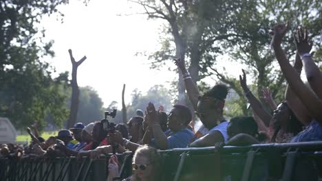 Push-in-shot-of-A-crowd-of-people-dancing-at-a-music-festival-in-summer,-at-the-Leeds-Black-Music-Festival-2019