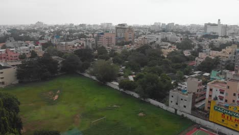 Wet-Playing-Ground-Rainy-Clouds,-Chennai-City-and-4k-Drone-video-City-of-Chennai,-Tamil-Nadu,-India