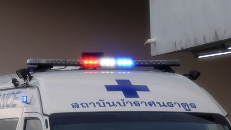 Ambulances-turn-on-emergency-lights-while-transporting-patients-infected-with-Corona-2019-during-the-global-Covid-19-epidemic-situation-in-Nonthaburi,-Thailand