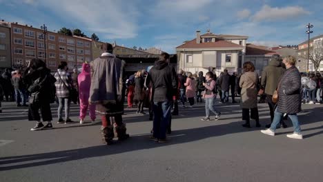 POV-Walking-Past-Crowds-At-Local-Carnival-In-Ordes,-Spain-On-5-March-2022