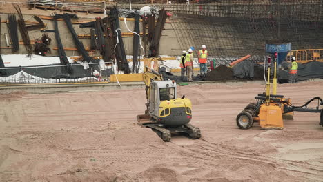 Skilled-Operator-Climb-Into-Tracked-Loader-To-Work-Inside-The-Santiago-Bernabeu-Stadium-In-Madrid,-Spain