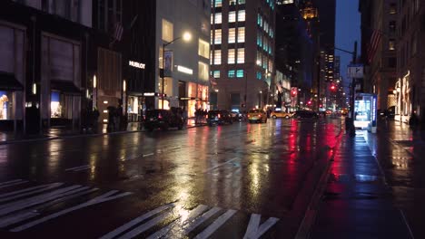 Panoramic-shot-of-5th-avenue-in-New-York-City-during-a-rainy-night-in-April