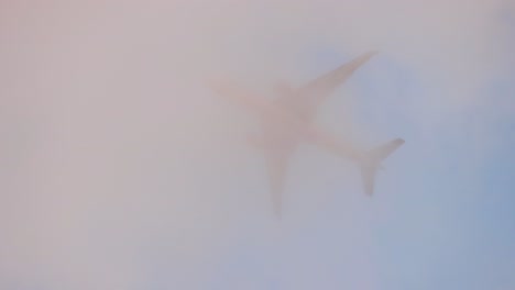 Qatar-airways-passenger-jet-airliner-flight-passing-through-clouds