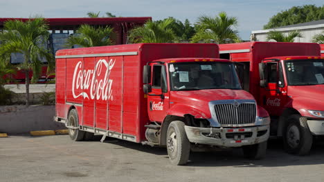 View-Of-Parked-Red-Coca-Cola-Truck-At-Distribution-Centre-In-Punta-Cana,-Dominican-Republic