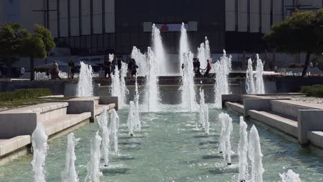 Fountains-in-front-of-the-National-Palace-of-Culture-in-autumn-on-a-lazy-Sunday,-Sofia,-Bulgaria