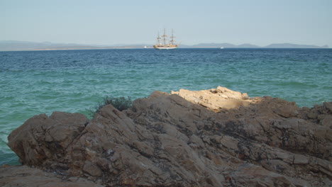 Amerigo-Vespucci-seen-from-Sardinia-coast,-paradise-turquoise-water,-sunny-day