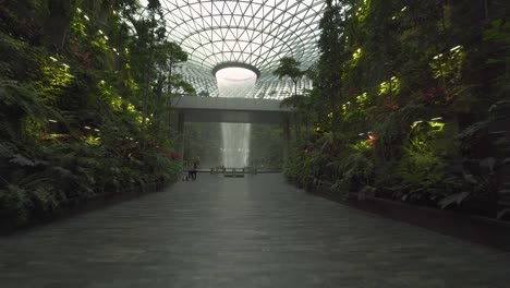 POV-Walking-towards-the-world's-tallest-indoor-waterfall-in-Jewel-Changi-Airport-in-Singapore-4k