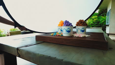 ice-cream-shaved-and-prepared-on-top-of-wood-block-with-reflector-for-food-photography-purple-and-brown-chocolate-marshmallow