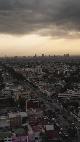 Stormy-afternoon-in-Mexico-City,-vertical-aerial-view