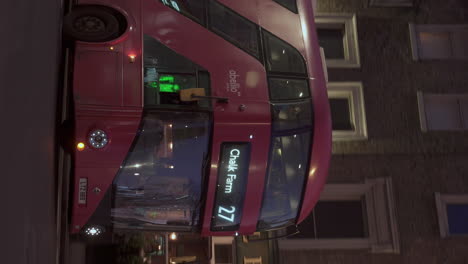 Vertical-Tracking-Shot-Public-Bus-Number-27-Turning-Right-Going-to-Chalk-Farm