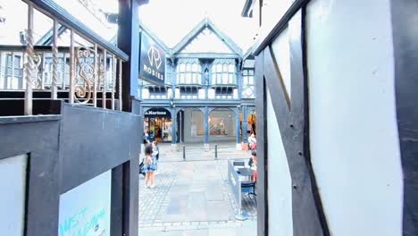 View-of-shops-and-bars-from-Northgate-Street-in-the-heart-of-Chester-Cheshire-England-UK