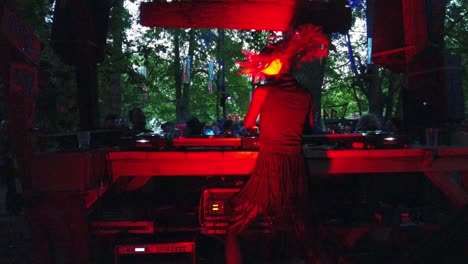 artist-dances-and-jumps-like-a-witch-with-red-light