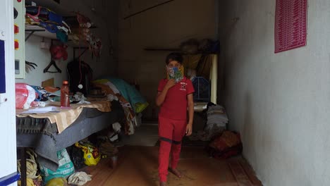 Young-Indian-Boy-Walks-to-Camera-Removes-Covid-19-Face-Mask-Scarf-Waves-and-Smiles