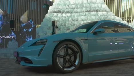 Frozen-blue-color-Porsche-Taycan-Turbo-S-charging-showroom