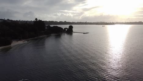 Aerial-View-Of-Kayaker-With-Beautiful-Sunset,-Swan-River-Perth-Australia