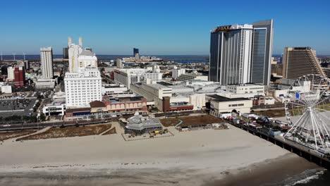 A-slowly-forward-moving-aerial-view-of-the-iconic-Atlantic-City-shoreline-and-boardwalk