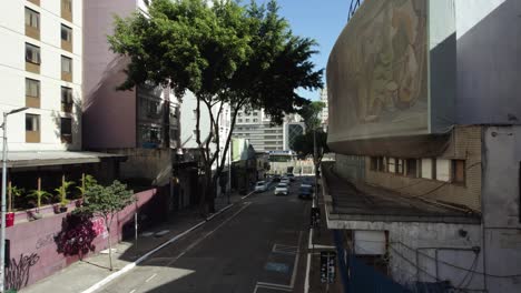 Aerial-view-low-over-streets-of-Consolação,-sunny-day-in-São-Paulo,-Brazil---Teatro-Cultura-Artística---Rua-Nestor-Pestana