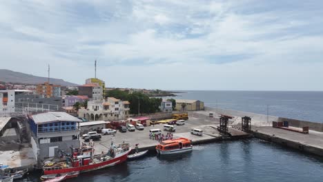 Aerial-View,-Port-of-Tarrafal,-Santiago-Island,-Cape-Verde,-Boats,-People-and-Buildings,-Drone-Shot