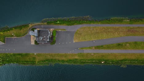 Ariel-shot-of-Triathlon-at-Dorney-lake,-triathletes-cycling-and-competing-on-the-track